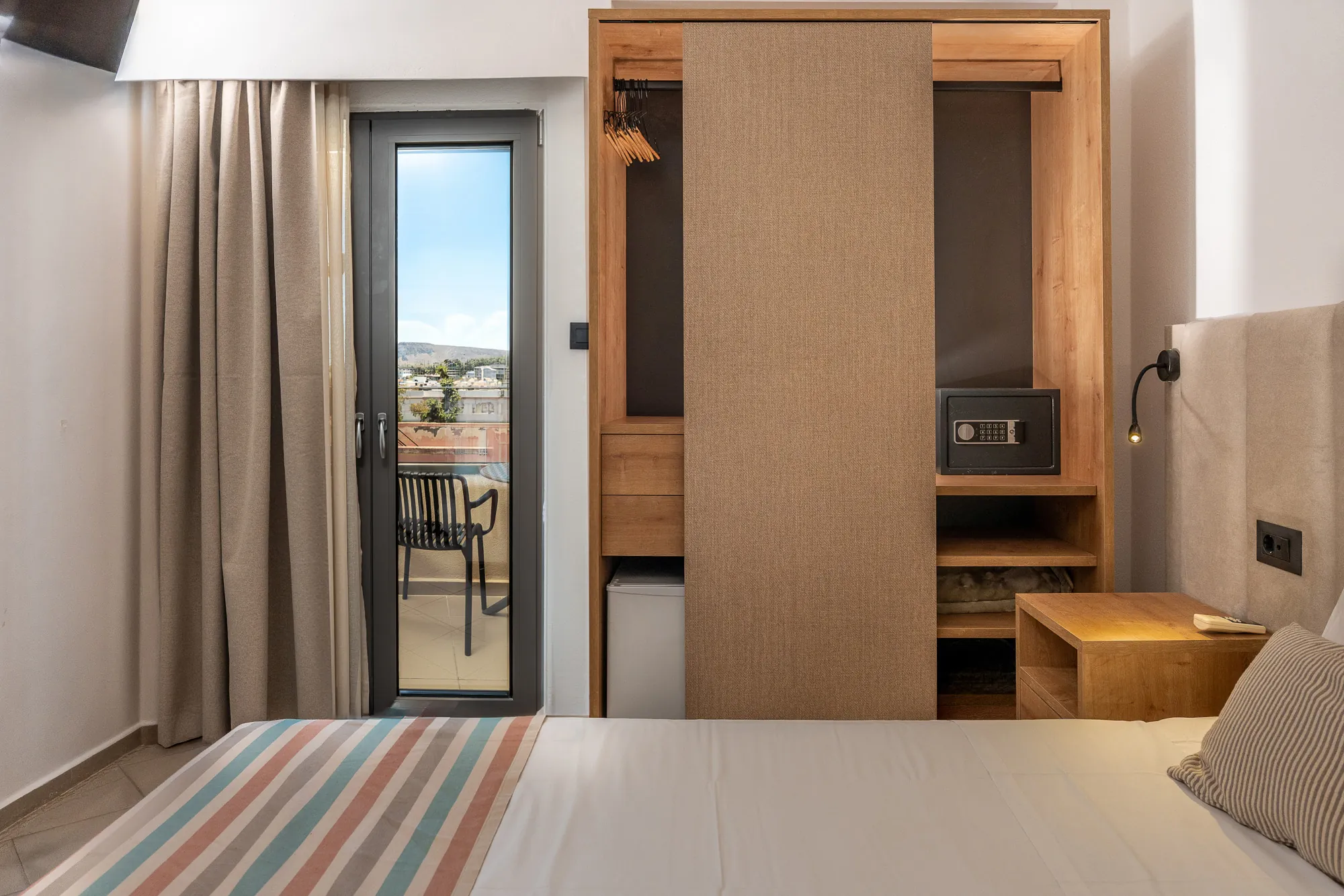 erato-hotel-double-room-04-wardrobe-and-balcony-view